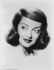 Bette Davis close-up portrait in white suit looking left.