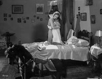 Greta Garbo embracing someone on the bed - iconic photo print
