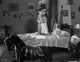 Greta Garbo embracing someone on the bed - iconic photo print