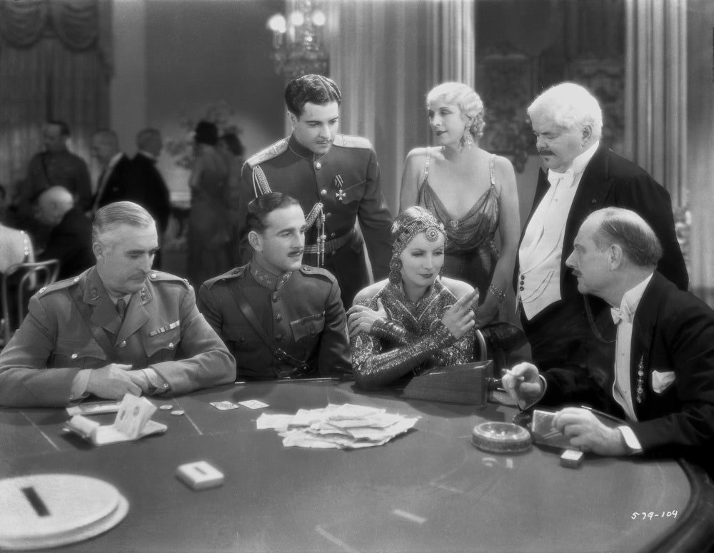 Greta Garbo talking to a man from a movie scene photo print.