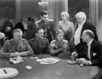 Greta Garbo talking to a man from a movie scene photo print.