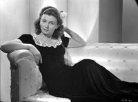Lenore Aubert Photo Print sitting elegantly on a couch