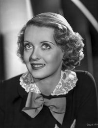 Bette Davis classic portrait photo print with white silk collar and black long sleeves.