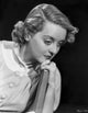 Bette Davis portrait photo print with finger wave hairstyle in white shirt.