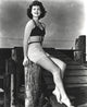 Ava Gardner smiling pose photo print showcasing classic Hollywood beauty.