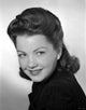 Anne Baxter smiling portrait photo print capturing classic Hollywood elegance.