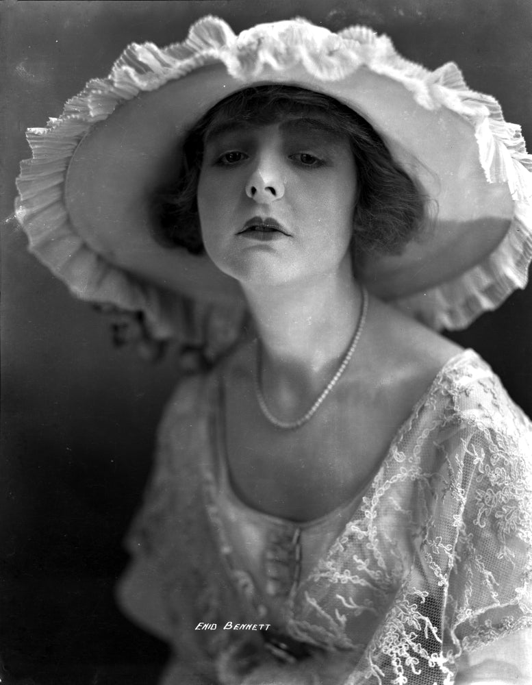 Enid Bennett portrait photo print in embroidered dress with hat.