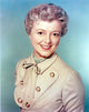 Janet Gaynor smiling portrait photo print showcasing classic Hollywood charm.
