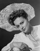 Portrait of Olivia DeHavilland wearing a classic hat, photo print.
