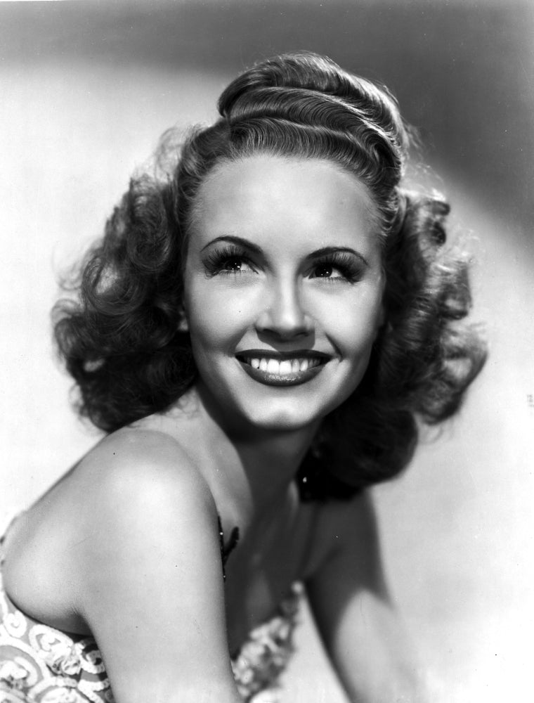 Janet Blair smiling photo print capturing classic cinema charm.