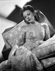 Janet Blair sitting in embroidered dress photo print.
