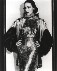 Dolores Del Rio posed in an elegant black and white photo print.