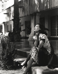 Dolores Del Rio sitting outside her house photo print