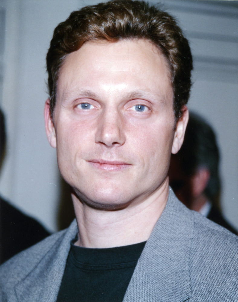 Tony Goldwyn posed in a suit photo print, elegant wall decor.