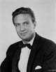 A Portrait Of Robert Stack Photo Print showcasing classic Hollywood charm.