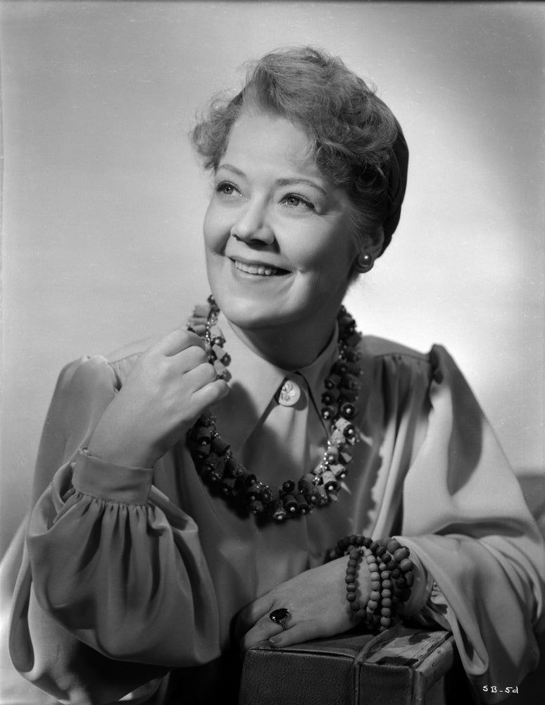 Spring Byington smiling in a formal dress black and white portrait photo print.
