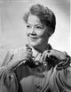 Spring Byington smiling in a formal dress black and white portrait photo print.