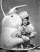 Judy Canova wearing a dress and hugged by a Giang Bunny - Classic Portrait Photo Print