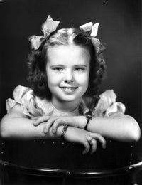 Classic portrait photo print of Joan Carroll with a charming smile