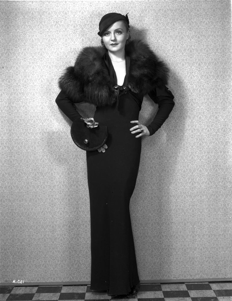 Classic photo print of Nancy Carroll with hands on waist