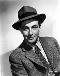 Robert Taylor posed in suit and hat photo print