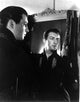 Robert Taylor publicity still photo print next to a mirror.