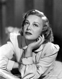 Madeleine Carroll looking up in white dress photo print