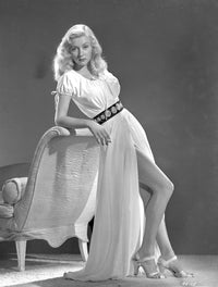 Gloria Grahame leaning on chair in white dress photo print