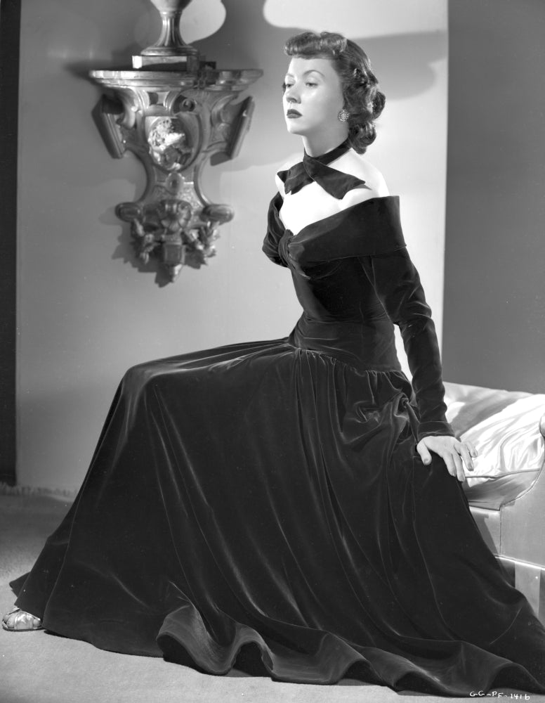 Gloria Grahame posed in a black dress photo print, classic Hollywood style.