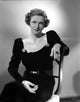 Irene Castle seated on chair in black dress photo print