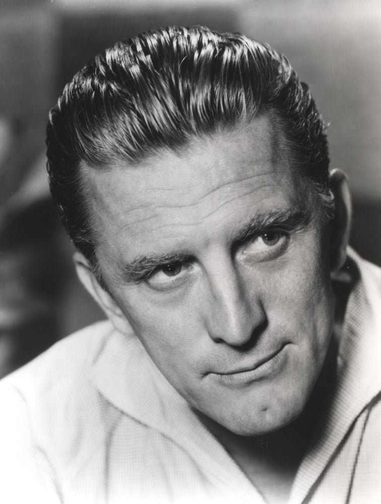 Close-up portrait photo print of Kirk Douglas in a white polo shirt.