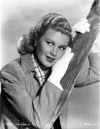 Joan Caulfield wearing a jacket in a classic photo print.