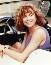 Polly Draper smiling in a purple tank top photo print