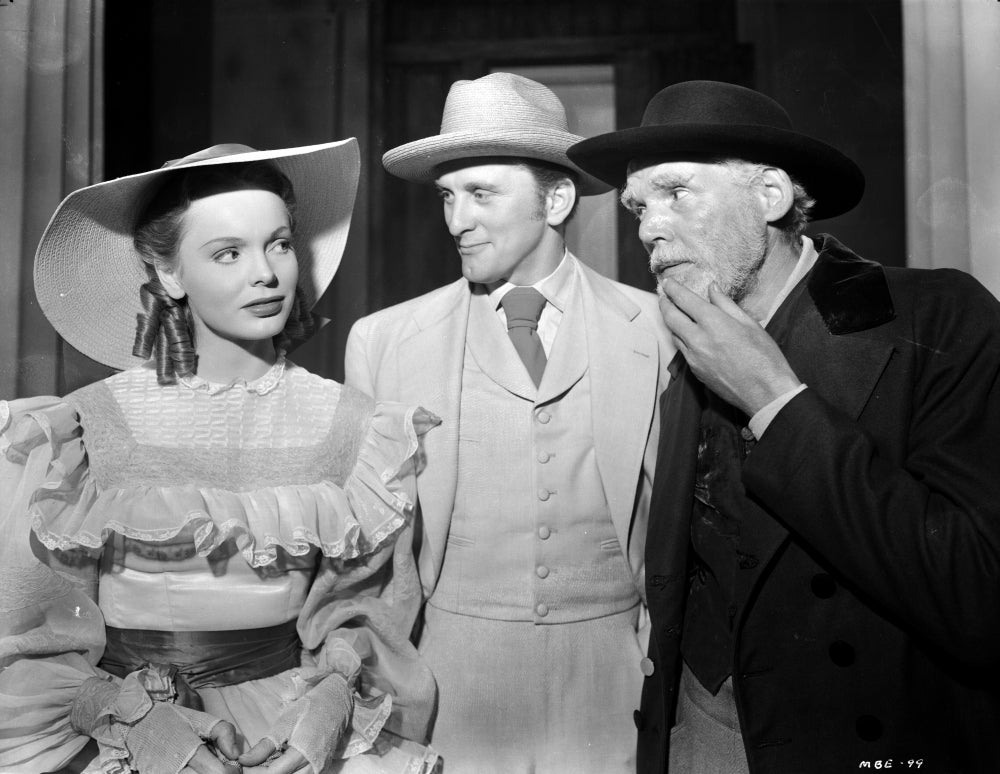 Film still photo print featuring Nancy Coleman and co-stars, capturing a classic cinematic moment.