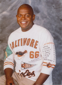 Portrait photo print of Charles Dutton smiling in a white shirt