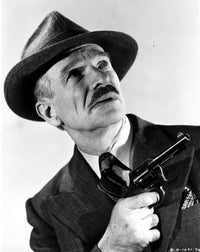 Ian Wolfe photo print in suit and tie with gun and hat.