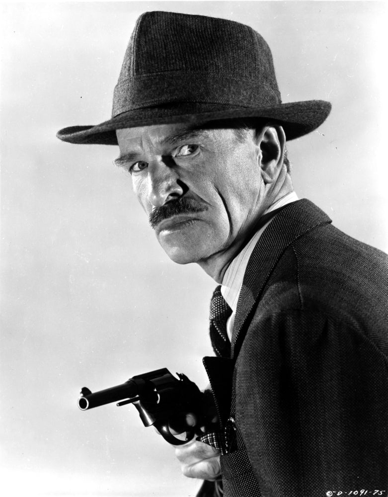 Ian Wolfe wearing a suit with a hat and gun photo print