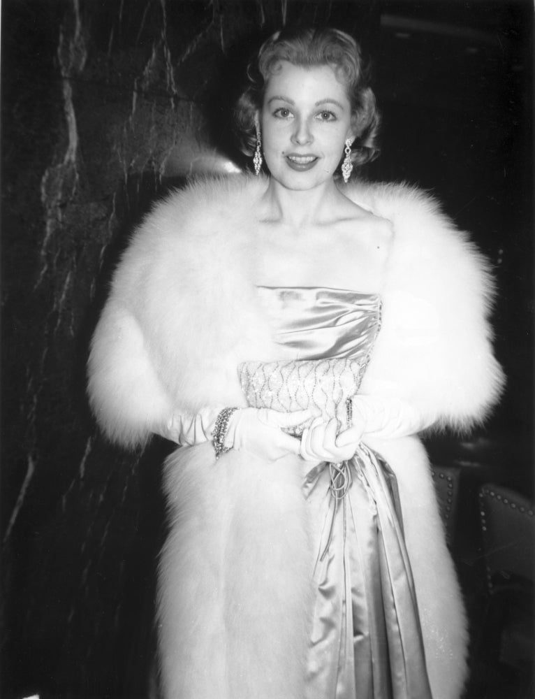 Photo print of Arline Dahl wearing an elegant evening dress.