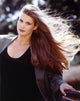 Photo print of Katie Haas posed in a black coat.