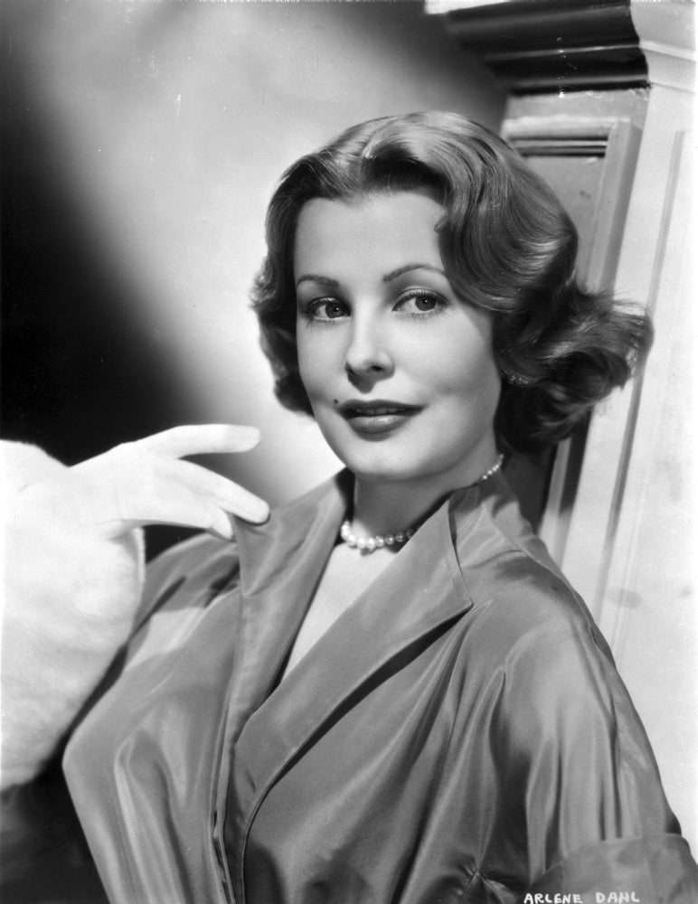 Arlene Dahl posed on side in classic hairdo with pearl necklace photo print.