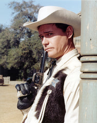Larry Hagman smiling in sheriff uniform holding a pistol photo print