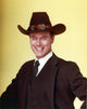 Larry Hagman smiling in a black suit photo print