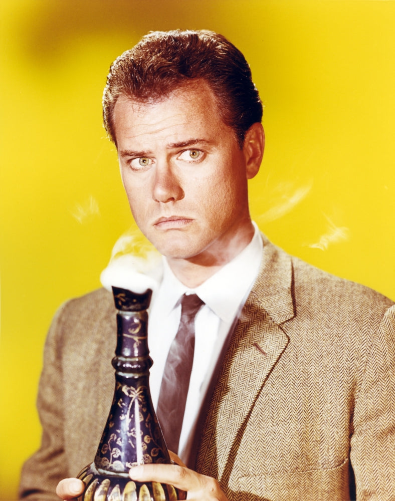 Larry Hagman posed photo print against a yellow background.