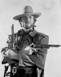 Clint Eastwood posed in cowboy attire with two pistols photo print.