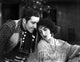 Bebe Daniels leaning back in a knitted dress photo print