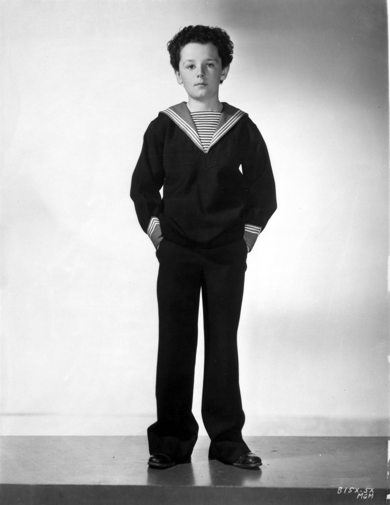 Freddie Bartholomew graduation cap photo print leaning on chair