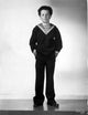 Freddie Bartholomew graduation cap photo print leaning on chair