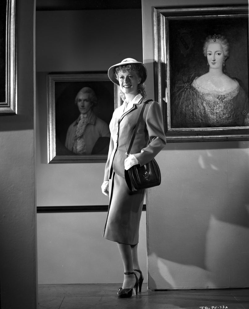 Joan Davis Leaning on a Wall Photo Print showcasing vintage charm.