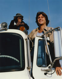 Greg Evigan leaning on a car with a monkey candid photo print.