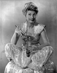 Black and white photo print of Joan Davis holding a lightbulb.